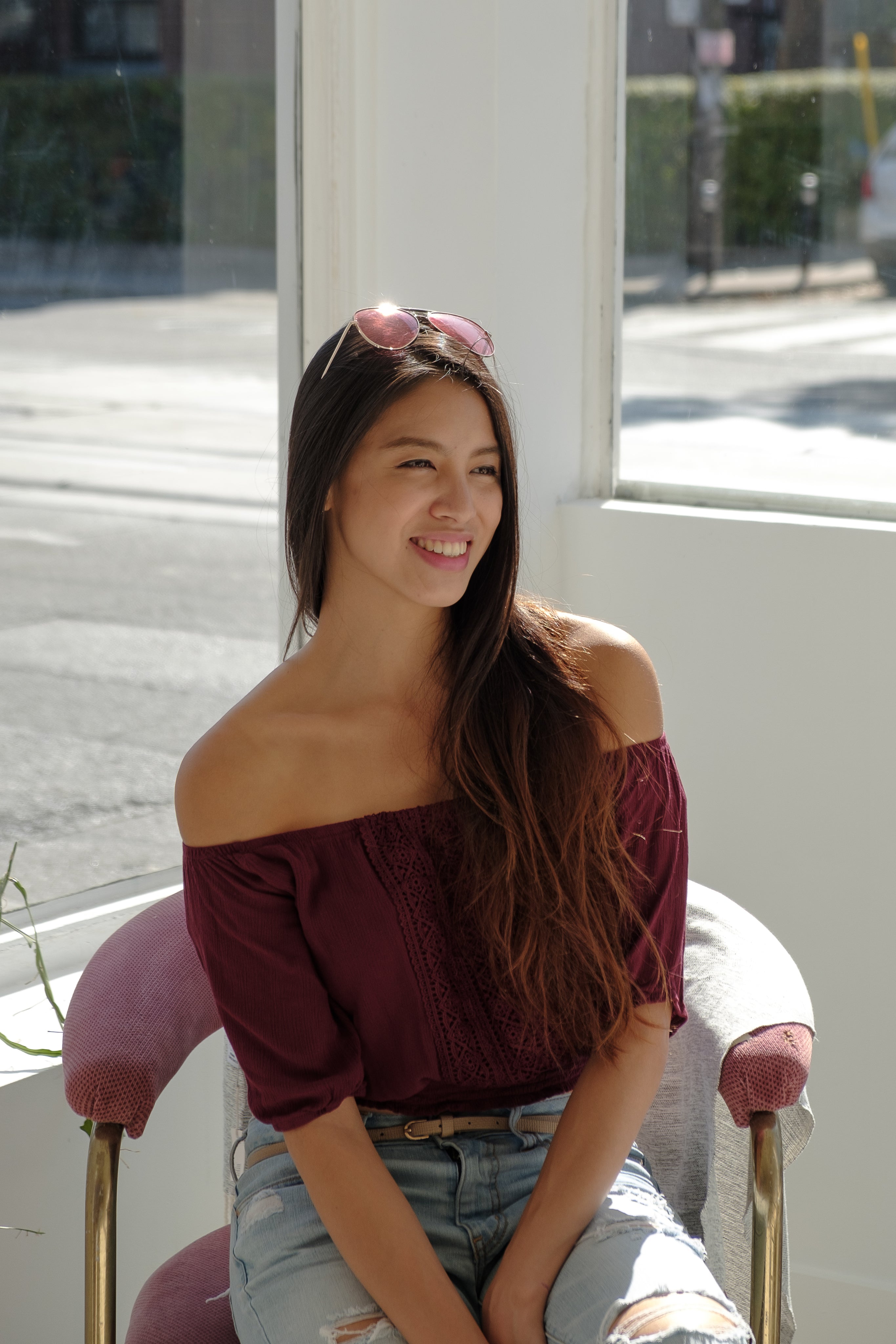 files/woman-smiling-while-sat-in-sunny-window.jpg